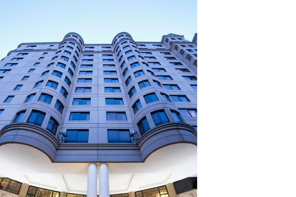 Stamford Grand Adelaide Hotel Glenelg Kültér fotó The photo shows a modern building with a distinct architectural design. The structure has multiple stories, featuring a series of rounded balconies and large windows that provide a sleek, contemporary look. The entrance is highlighted by a canopy sup